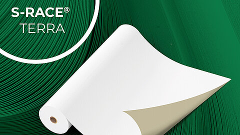 Large roll of paper on a green background with S-RACE Terra in a circle at the top left
